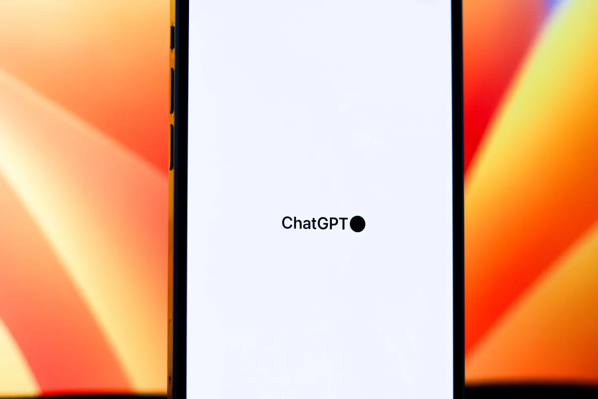 Close-up of a smartphone displaying ChatGPT with vibrant background. Ideal for t